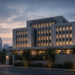 Modern institutional building facade at twilight in an urban financial district, conveying Bank of Japan policy atmosphere.