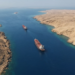 Two tankers in a narrow arid chokepoint between desert coasts (Bab el-Mandeb / Perim geography).