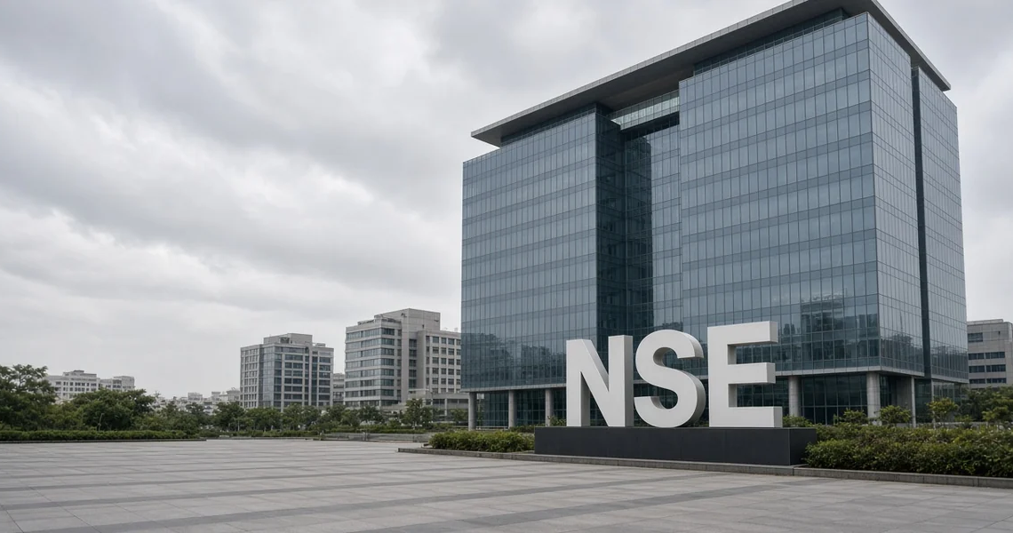 Monument NSE letters on a plaza in front of a modern exchange campus.