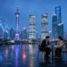 Shanghai financial district terrace at night with abstract market chart overlay, framing DeepSeek STAR IPO prep as sources-say mood without filing stamps or valuation text.