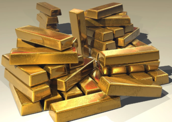 Gold bullion bars in warm light, suggesting gold price strength; last prints are not settles.
