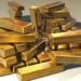 Gold bullion bars in warm light, suggesting gold price strength; last prints are not settles.